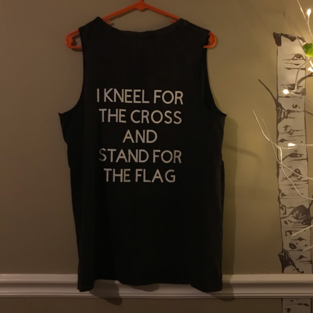 I kneel for the cross and stand for the flag